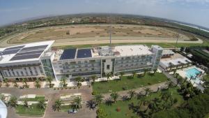 an overhead view of a building with solar panels on it at Eureka Palace Hotel Spa Resort in Cassibile