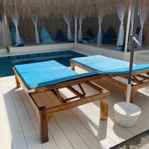 a massage table on the deck of a resort at Acqualanta House in Ko Lanta