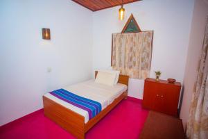 Postel nebo postele na pokoji v ubytování Villa Trendy Unawatuna