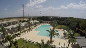 an overhead view of a swimming pool in a resort at Eureka Palace Hotel Spa Resort in Cassibile
