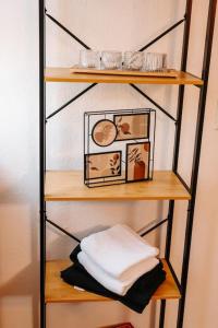 a shelf with some items on top of it at Modern & black - City - Netflix - Wifi - 4 Person in Bochum