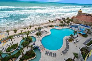 an overhead view of a pool and the ocean at Beachfront Luxury Villa Ocean Walk Resort Daytona in Daytona Beach