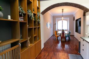 a kitchen and dining room with a table and chairs at sweet house deluxe in Milan