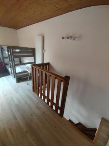 a room with a wooden staircase and a room with a window at Appartement T3 50m² - 6 pers. - Barcelonnette in Barcelonnette