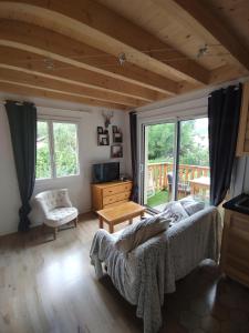 a bedroom with a bed and a television in a room at Appartement T3 50m² - 6 pers. - Barcelonnette in Barcelonnette