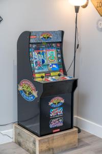 a pinball machine on display in a room at Luxury Flat with private terrace in the Heart of Kingston in London