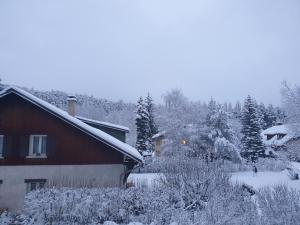 a house covered in snow next to a house at Appartement T3 50m² - 6 pers. - Barcelonnette in Barcelonnette
