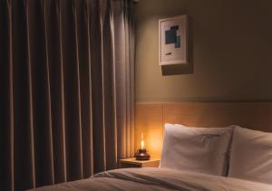 Nampo Ocean2Heaven Hotel& Spa房間的床