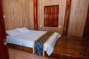 Postel nebo postele na pokoji v ubytování Khu nghỉ dưỡng Tommy Hồ Tràm