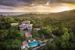 an aerial view of a house in the forest at The Horizon Hill Top Villa in Unawatuna
