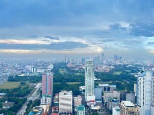 a view of a city with buildings and trees at Dreamy Sunset Bay in Manila