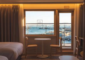 Nampo Ocean2Heaven Hotel& Spa房間的床