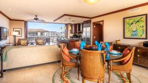 a dining room with a table and chairs and a living room at Ko Olina Beach Villas O1111 in Kapolei +52 photos