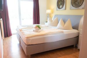 a bedroom with a bed with a stuffed animal on it at Apartment Ohragrund in Oberhof