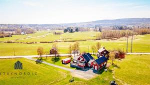 an aerial view of a house in a field at Charming and rural cottage in Ockelbo in Ockelbo