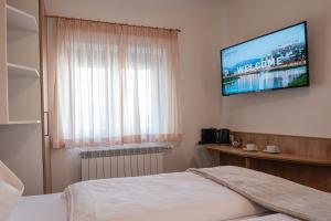 Ένα ή περισσότερα κρεβάτια σε δωμάτιο στο Hotel Modus
