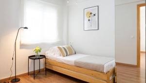 Säng eller sängar i ett rum på Elegant Malaga Retreat