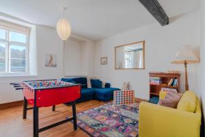 a living room with a ping pong table at Canons Court Lodge in Wotton-under-Edge