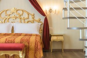 Postelja oz. postelje v sobi nastanitve Regina del Garda Suite
