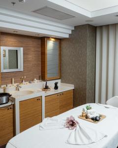 a bathroom with a sink and a mirror at FLY INN BAKU in Baku