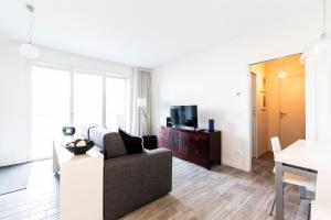 a living room with a couch and a tv at Bertelli 4 in San Lazzaro di Savena +63 photos