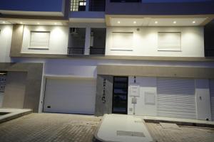 a view of a building with two garage doors at L'horizon 5 in Sfax