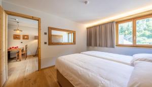 Voodi või voodid majutusasutuse SWISSPEAK Resorts Vercorin toas