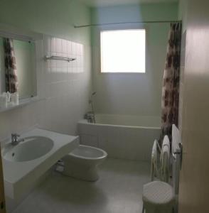 a bathroom with a sink and a toilet and a tub at Les Portes du Cantal in Massiac +37 photos