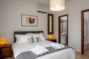 Postel nebo postele na pokoji v ubytování 3 Roses Residence