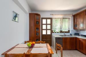 Kuchyň nebo kuchyňský kout v ubytování 3 Roses Residence