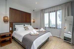 Postel nebo postele na pokoji v ubytování 3 Roses Residence