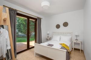 Postel nebo postele na pokoji v ubytování 3 Roses Residence