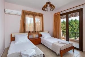Postel nebo postele na pokoji v ubytování 3 Roses Residence