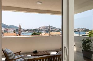 a balcony with a view of the city at Apartments aMare in Dubrovnik