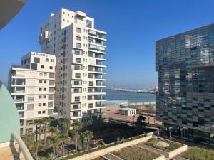 a view of two tall buildings and the ocean at Very beautiful apartment with see view 5th in Casablanca