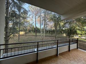 a balcony with a view of a park with trees at Volturno House2 in Rome