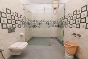 Ванна кімната в Yuvraj Heritage Shelter Resort