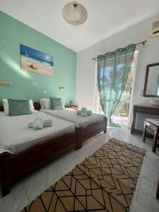 Ένα ή περισσότερα κρεβάτια σε δωμάτιο στο No Name Apartments