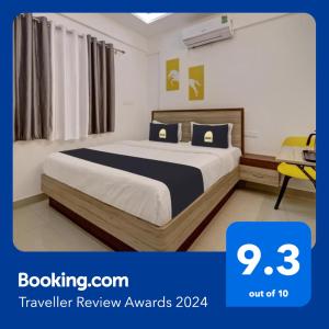 Ένα ή περισσότερα κρεβάτια σε δωμάτιο στο FabHotel Marella Grand Inn