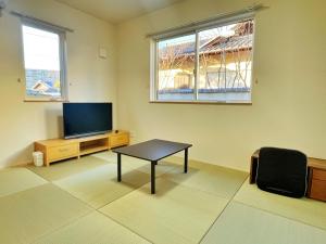 TV a/nebo společenská místnost v ubytování グローカル春日居温泉