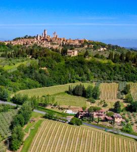 an aerial view of a village on a hill at Hotel Le Colline in San Gimignano