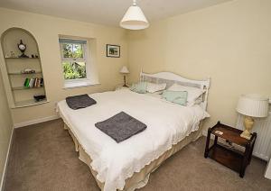En eller flere senge i et værelse på West Lodge 3 bedrooms, near golf course and river