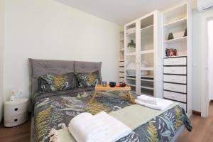 a bedroom with a king sized bed with a dresser at Didi's Central Designer Apartments in Sofia