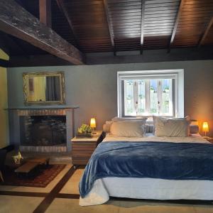 a bedroom with a large bed and a window at O Vilarejo - Lagoa da Conceição in Florianópolis