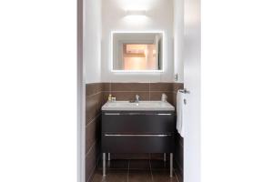 a bathroom with a sink and a mirror at Bes Residence Bergamo Polaresco in Bergamo