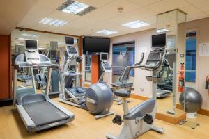 a gym with treadmills and elliptical machines at Grand Hotel Blackpool in Blackpool +31 photos