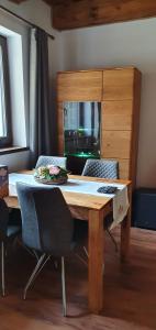 a wooden table in a room with a tableablish at Chata Krpko in Horná Lehota