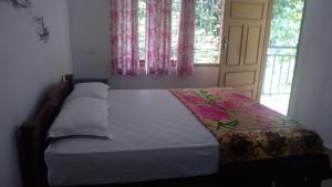 Postel nebo postele na pokoji v ubytování Dream Nest Homestay + 4 fotografie