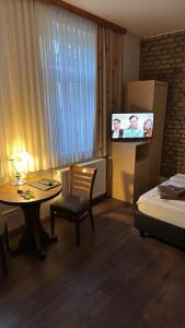 Postel nebo postele na pokoji v ubytování Pensionszimmer Unicat