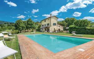 an exterior view of a house with a swimming pool at Villa Millefiori in Spoleto